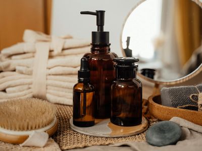 Minimalist arrangement of a water bottle and a grey towel.